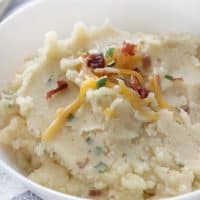 Slow cooker loaded mashed potatoes are the PERFECT side to bring to any pot luck gathering! So easy and so GOOD!
