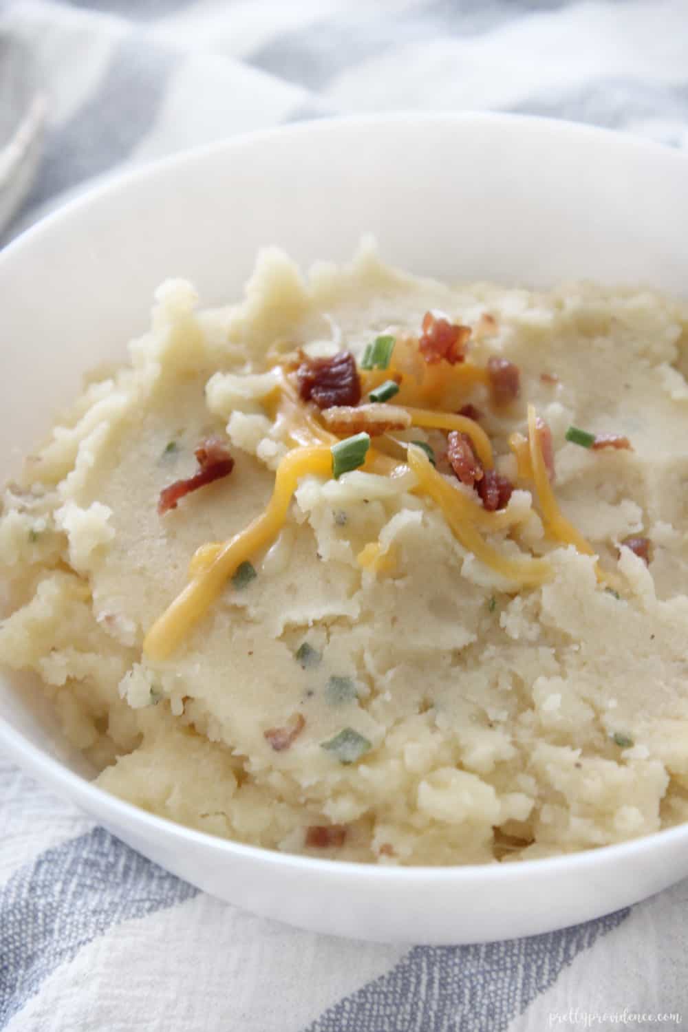 Slow cooker loaded mashed potatoes are the PERFECT side to bring to any pot luck gathering! So easy and so GOOD!