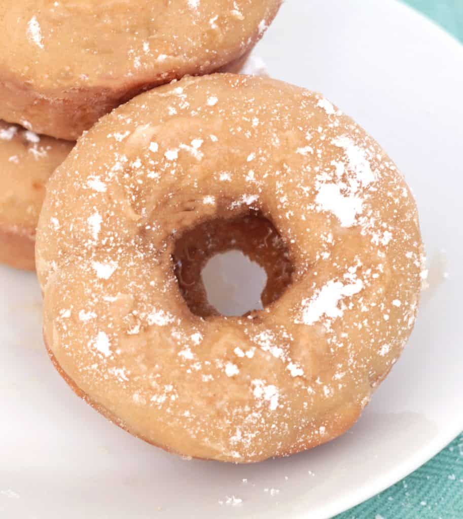 Cookie Butter Cake Donut with powdered sugar dusted on top.