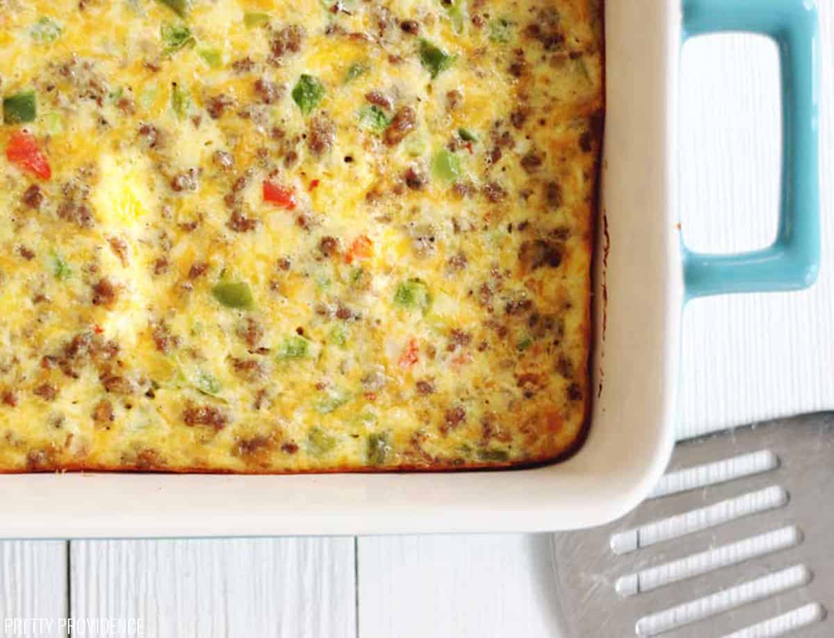 birds eye view of a pan of the worlds best breakfast casserole recipe next to a spatula