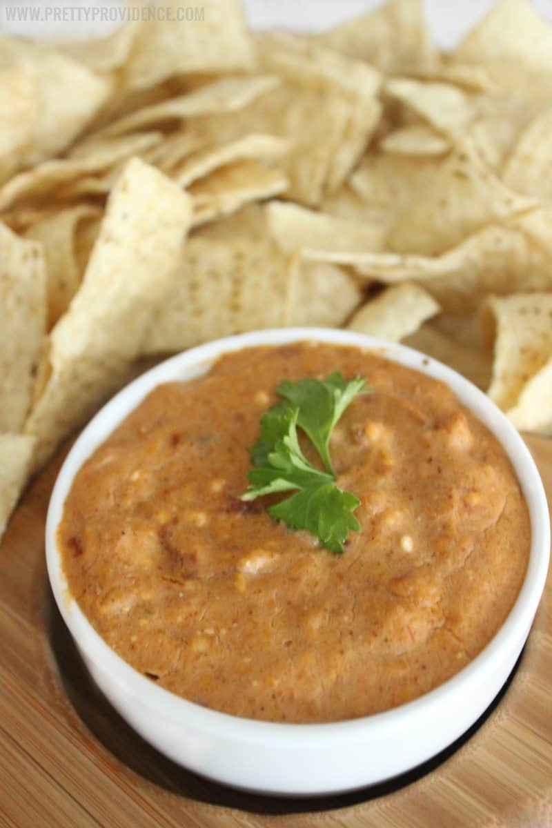 This cheesy crock pot bean dip is AMAZING!! Definitely my go-to recipe for any party or gathering-- a total crowd pleaser! 