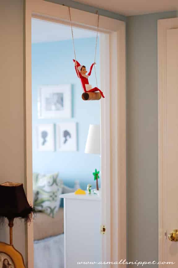 Swinging on a Toilet Paper Roll Elf on the Shelf. Click for more ideas! #elfontheshelf