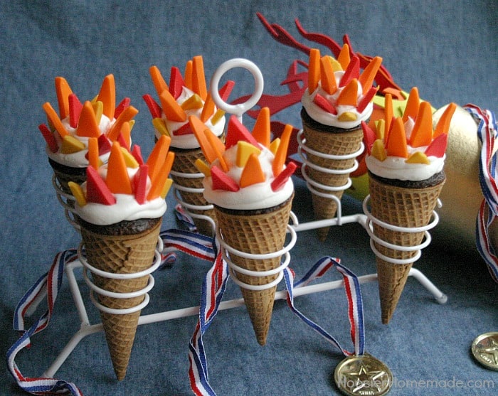 Olympic Torch Cupcakes in ice cream cones with candy flames in an ice cream cone stand from HoosierHomemade.com