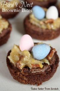 A small brownie bite with coconut frosting topped with two Cadbury eggs.