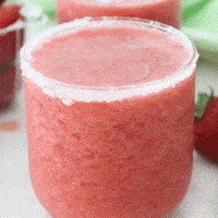 close up of a sugar rimmed glass of strawberry slush