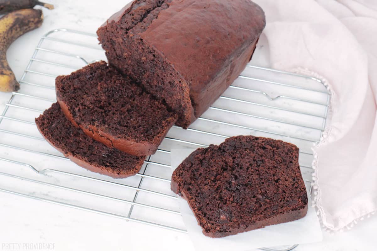 Chocolate Banana Bread loaf sliced on a cooling rack
