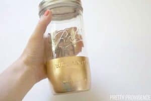 Mason jar tumbler with gold spray paint on bottom half