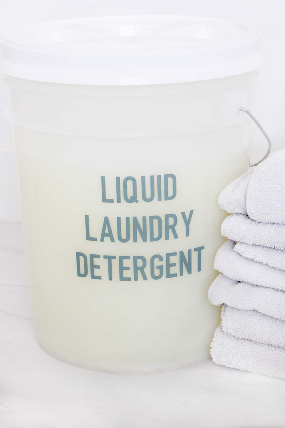 5 gallon bucket that said "liquid laundry detergent" in blue vinyl