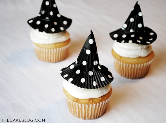 Witch hats made of cupcake liners on top of cupcakes