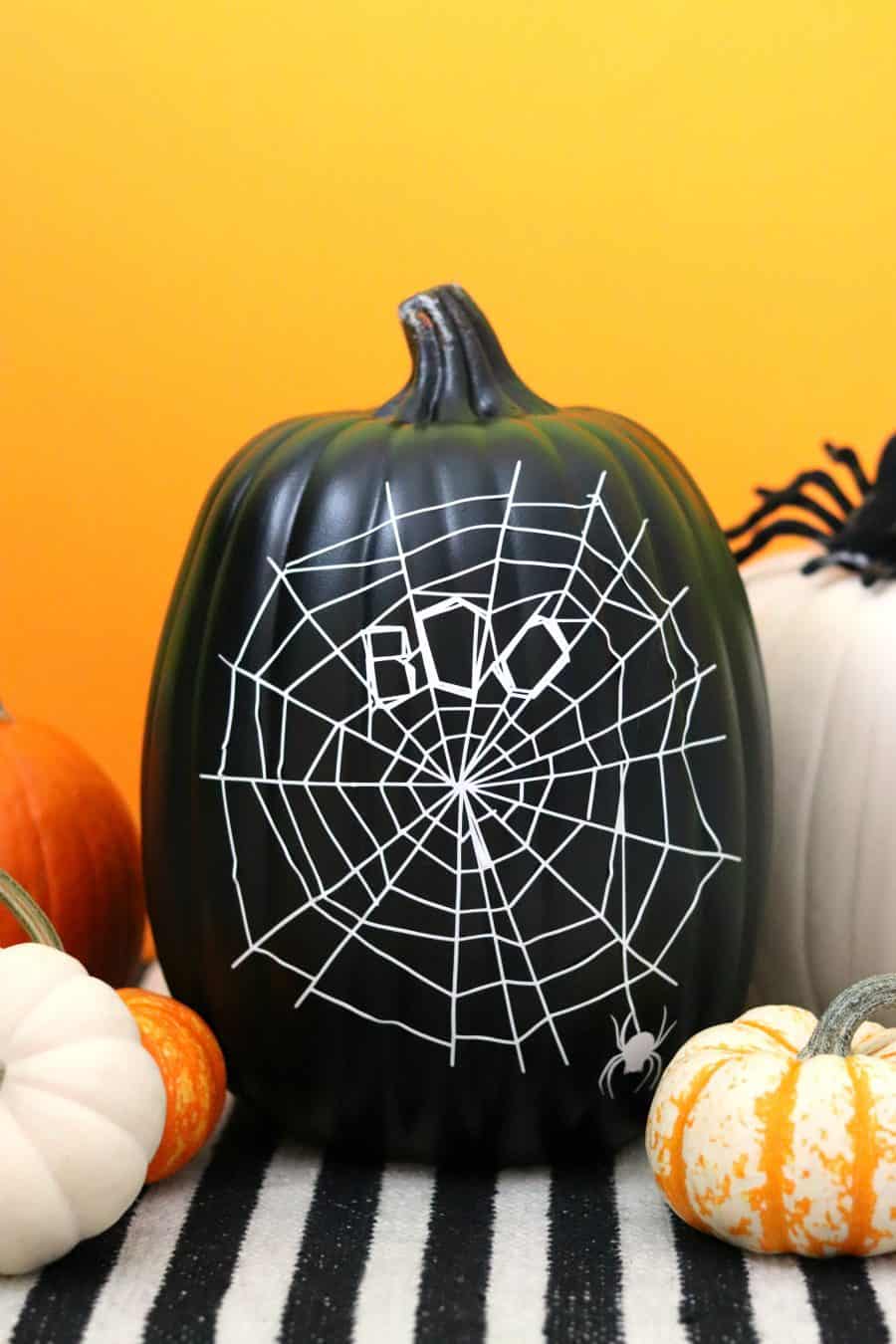 Halloween No-Carve Pumpkin with a spiderweb made with Vinyl