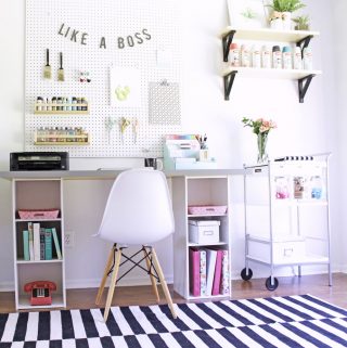 This craft room is organized so well and it's basically all IKEA! The desk is an IKEA hack, bookshelf for craft storage is from IKEA too!