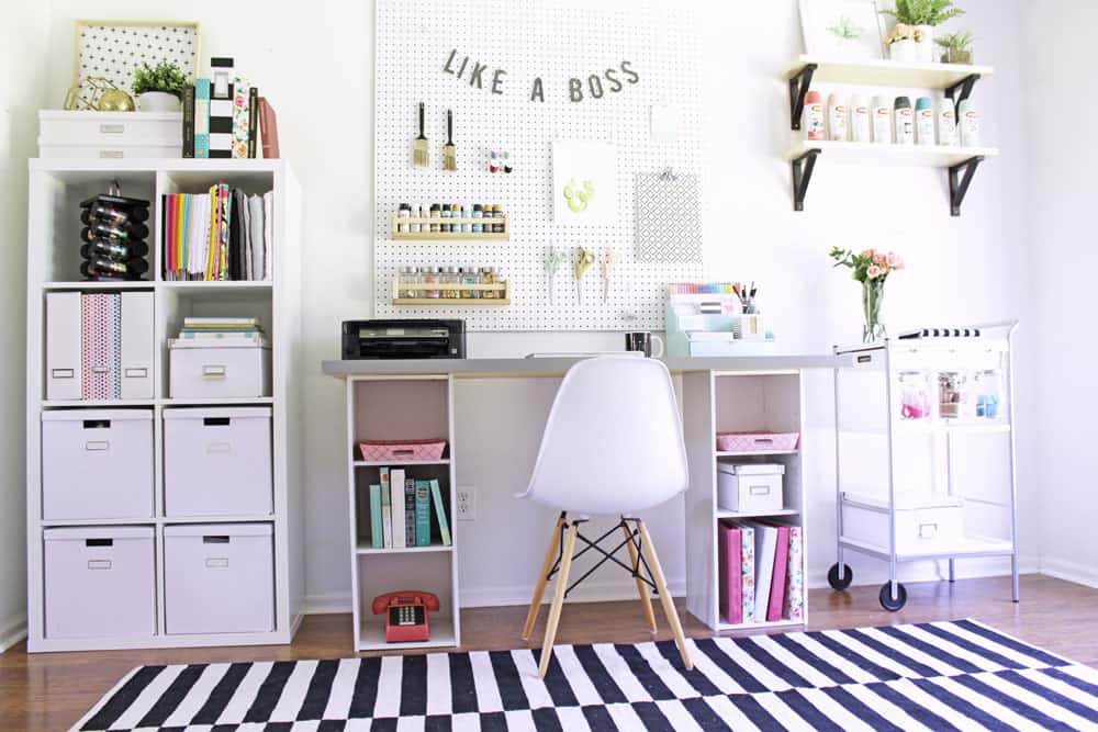 This craft room is organized so well and it's basically all IKEA! The desk is an IKEA hack, bookshelf for craft storage is from IKEA too!