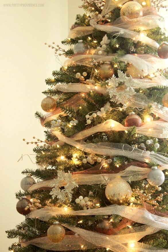 I am in love with this whimsical precious metals Christmas tree! Doesn't it just make you want to curl up with a blanket and watch lights dance for hours? Click through for how to's and more images!