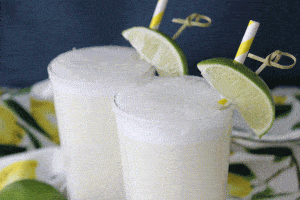 close in shot of two sugar rimmed glasses of Brazilian lemonade.