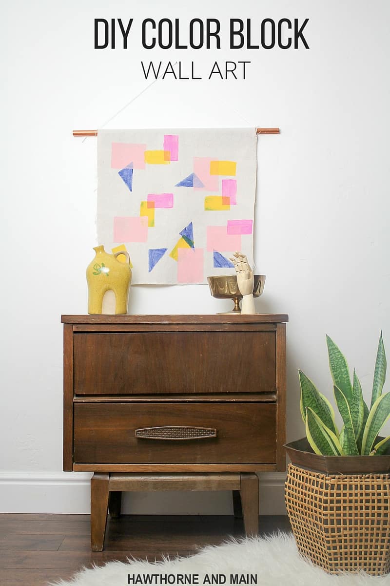 Check out how easy this color block wall art is to create. I think I could totally make this. Definitely pinning for later! 