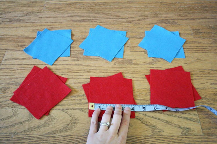 Blue and red felt squares with a measuring tape.