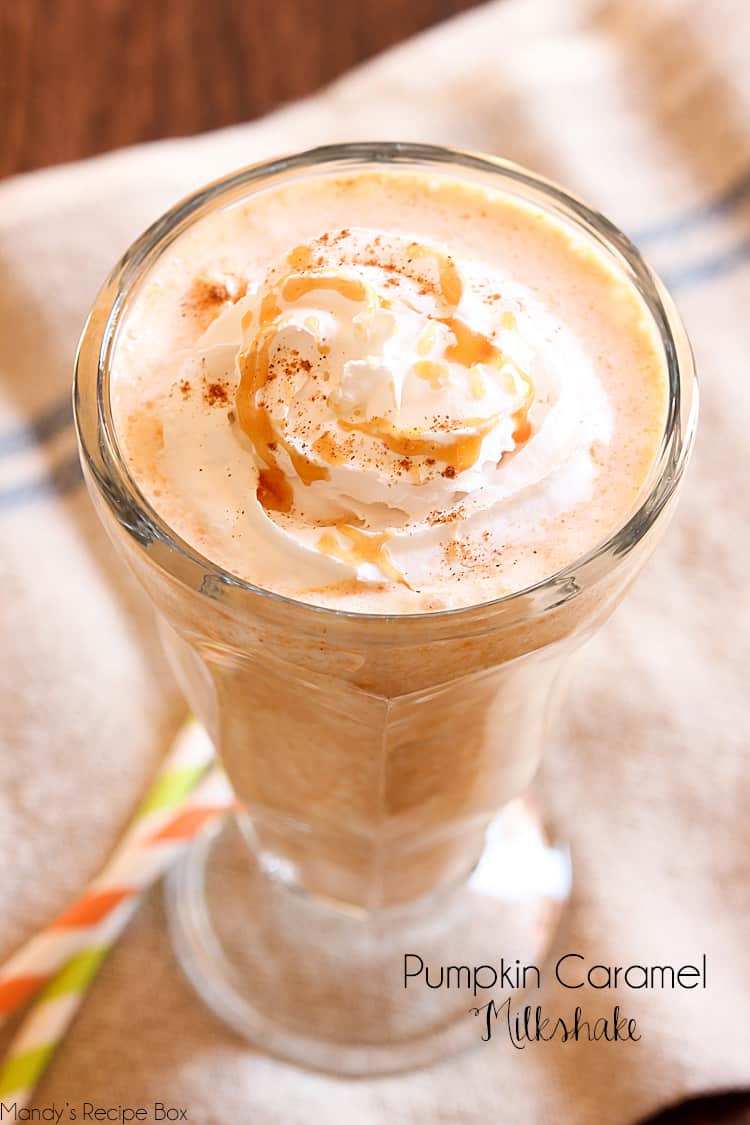 Pumpkin Caramel Milkshake in a clear old fashioned ice cream dish sitting on a napkin