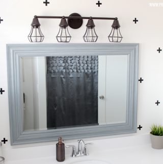 A super fun and easy boys bathroom makeover! on a budget! I can't believe how easy those wall decals were to apply!