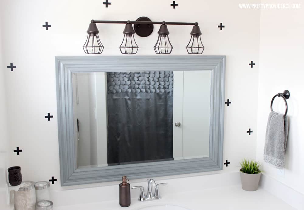 A super fun and easy boys bathroom makeover! on a budget! I can't believe how easy those wall decals were to apply! 