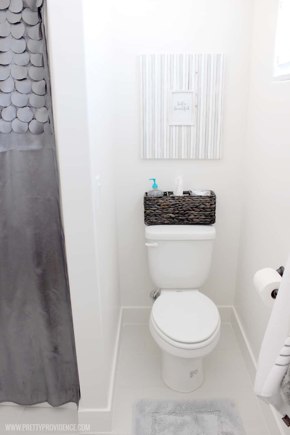 A super fun and easy boys bathroom makeover! on a budget! I can't believe how easy those wall decals were to apply! 