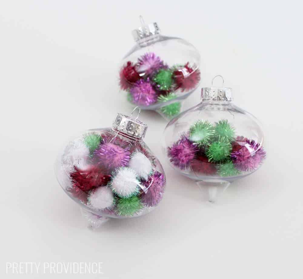 Totally doing this!!! Fun and easy DIY pom pom ornament. I LOVE these and you can use whatever colors of pom poms you want!!