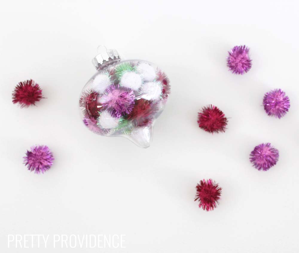 Totally doing this!!! Fun and easy DIY ornament. I LOVE these and you can use whatever colors of pom poms you want!! 