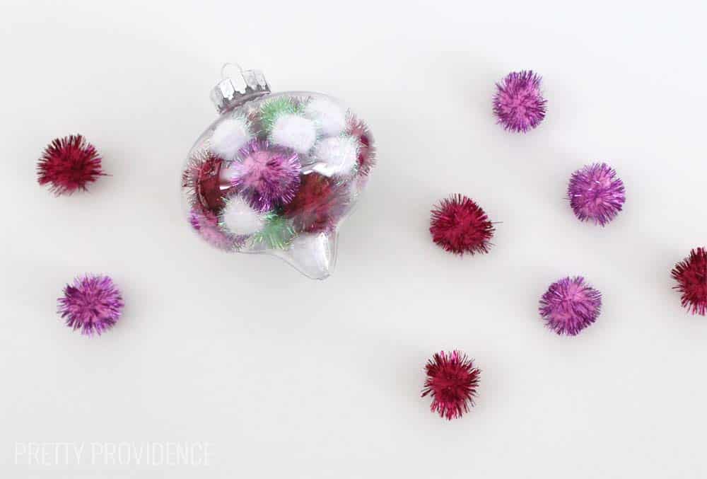 Totally doing this!!! Fun and easy DIY ornament. I LOVE these and you can use whatever colors of pom poms you want!! 