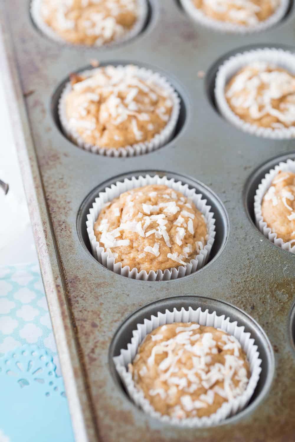 These Banana Coconut Muffins are delicious and simple! Coconut sugar and applesauce makes muffins something you can feel a little less guilty about! 