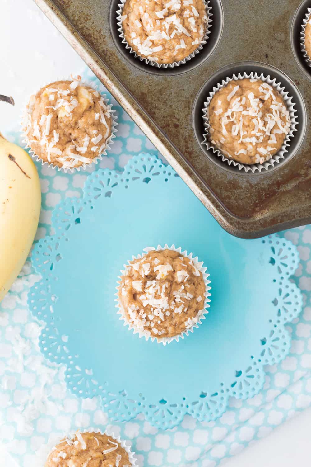 These Banana Coconut Muffins are delicious and simple! Coconut sugar and applesauce makes muffins something you can feel a little less guilty about! 