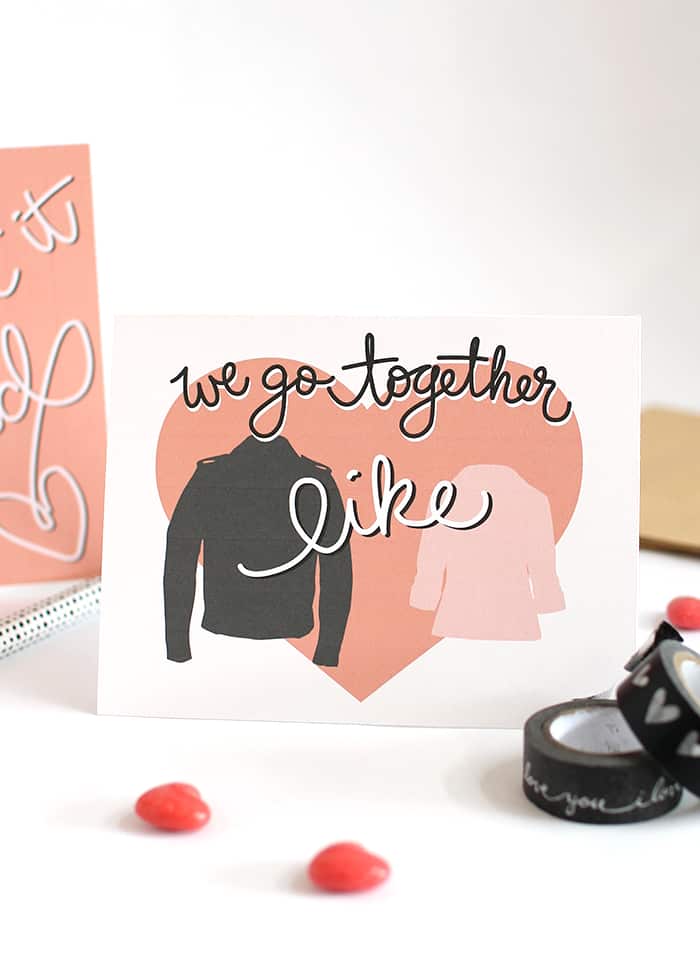 Grease Inspired printable valentine card with a pink heart, black leather jacket and pink jacket on it and the words "We go together like" 