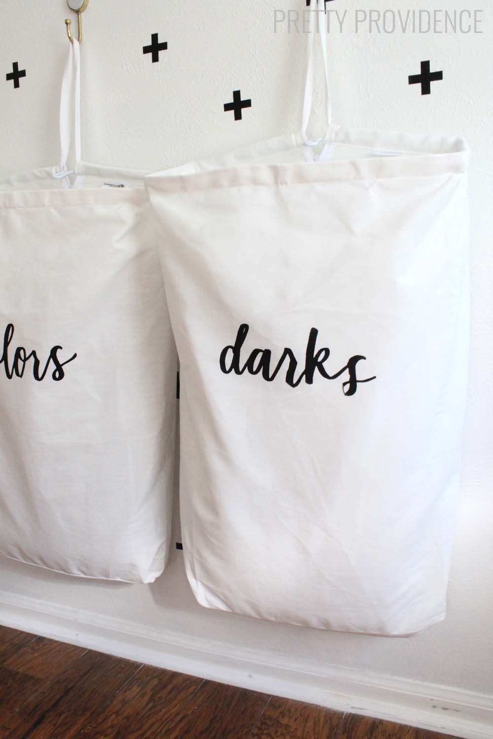 I love this space-saving laundry organization idea! The bag labels are so pretty too!