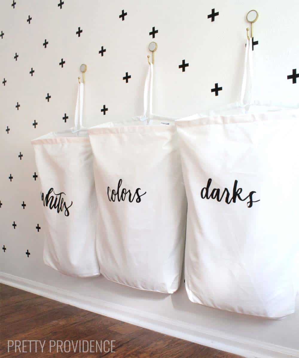 I love this space-saving laundry organization idea! The bag labels are so pretty too!