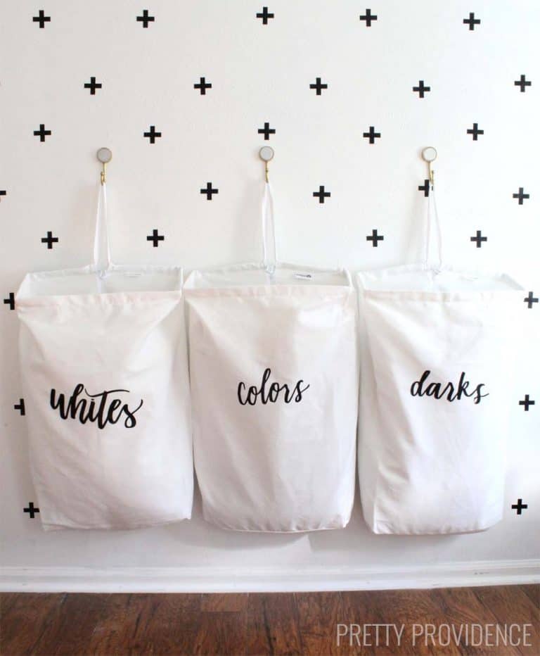 I love this space-saving laundry organization idea! The bag labels are so pretty too!