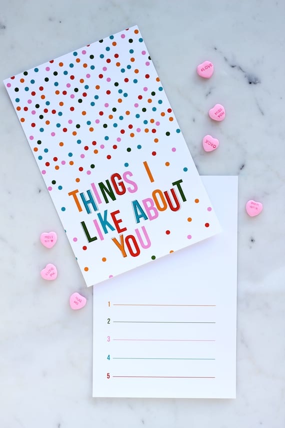 Valentine Printable with colorful confetti with text that reads "Things I like About You" with numbered lines inside of it.