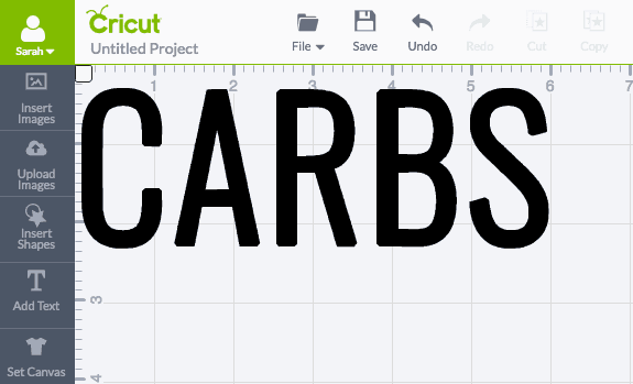Cricut vinyl word 'CARBS' on canvas in Cricut design space.