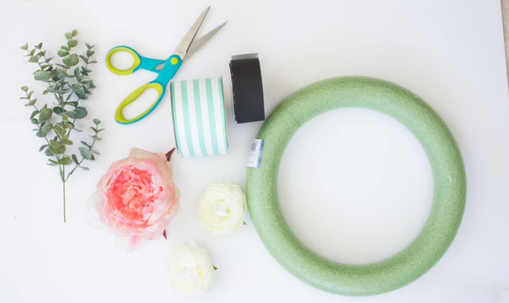 This easy spring wreath is easy to make with ribbon, faux flowers and a little bit of fun! 