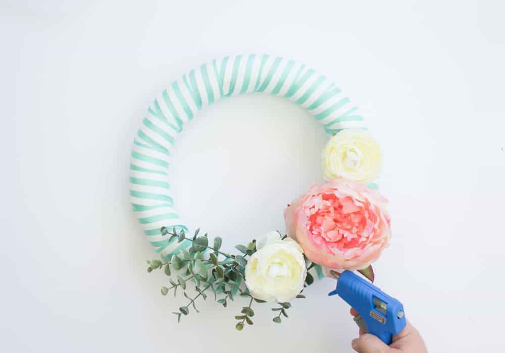 This easy spring wreath is easy to make with ribbon, faux flowers and a little bit of fun! 