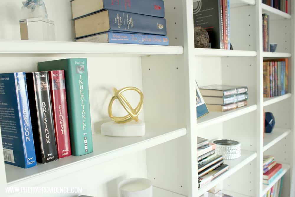 I am in love with this small front room converted to a cozy home library! I just want to sit there and read a book all day! 