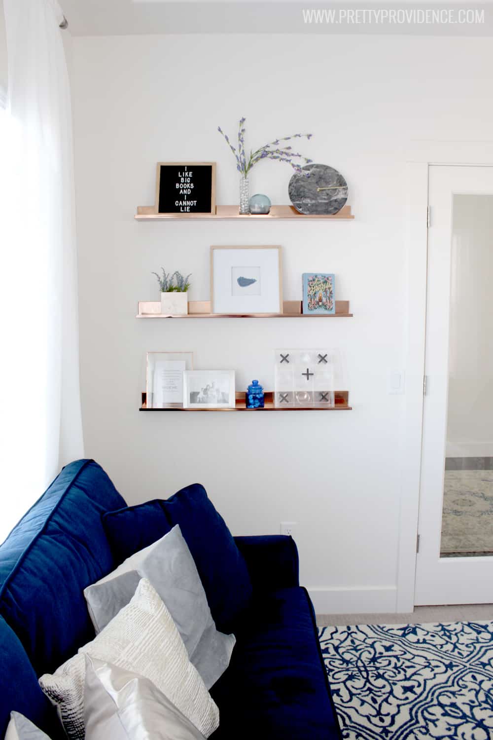 I am in love with this small front room converted to a cozy home library! I just want to sit there and read a book all day! 