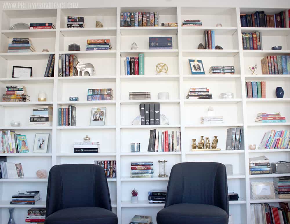 I am in love with this small front room converted to a cozy home library! I just want to sit there and read a book all day! 