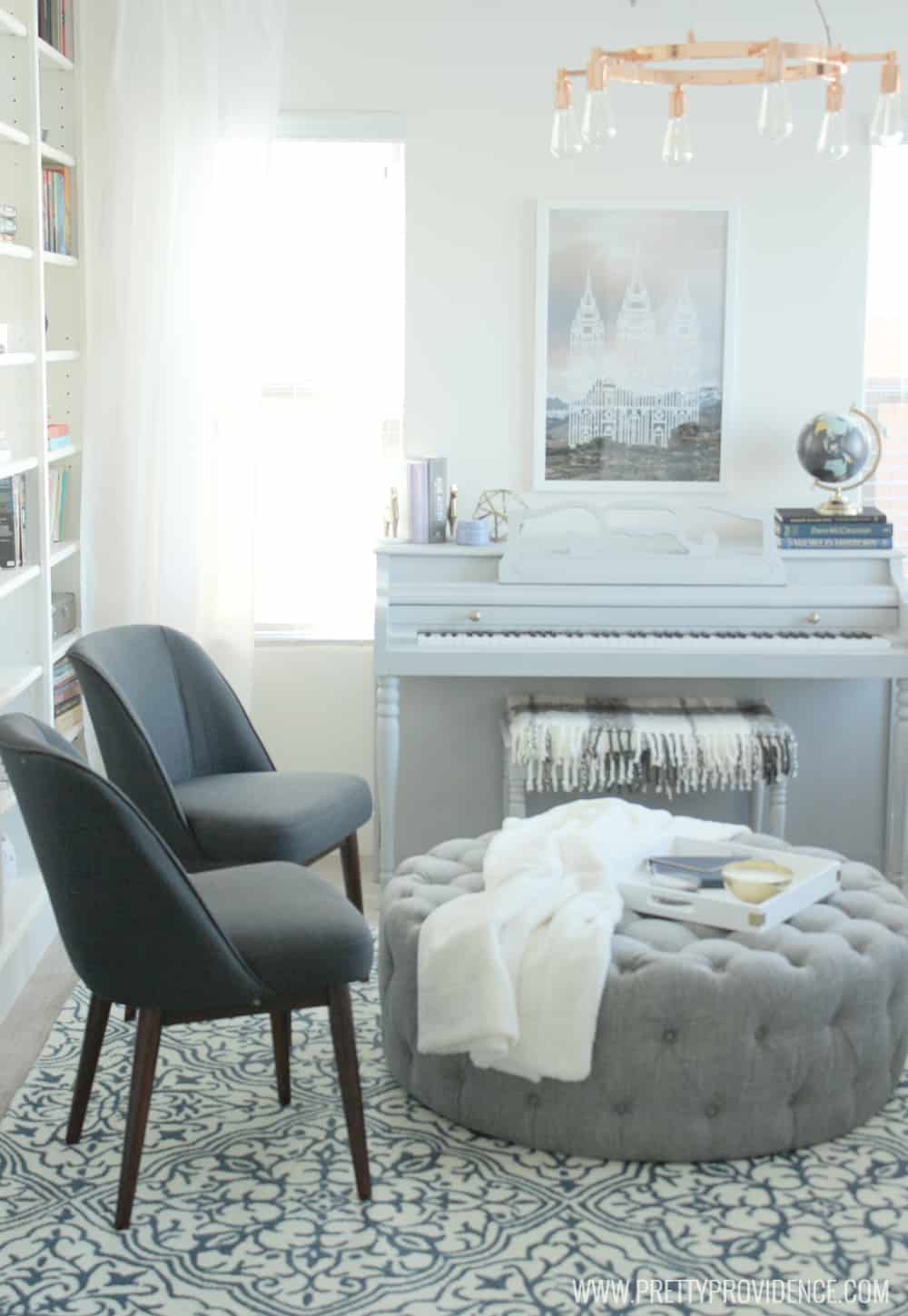 I am in love with this small front room converted to a cozy home library! I just want to sit there and read a book all day! 