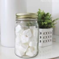 heart shaped toilet bombs in a mason jar on a bathroom counter