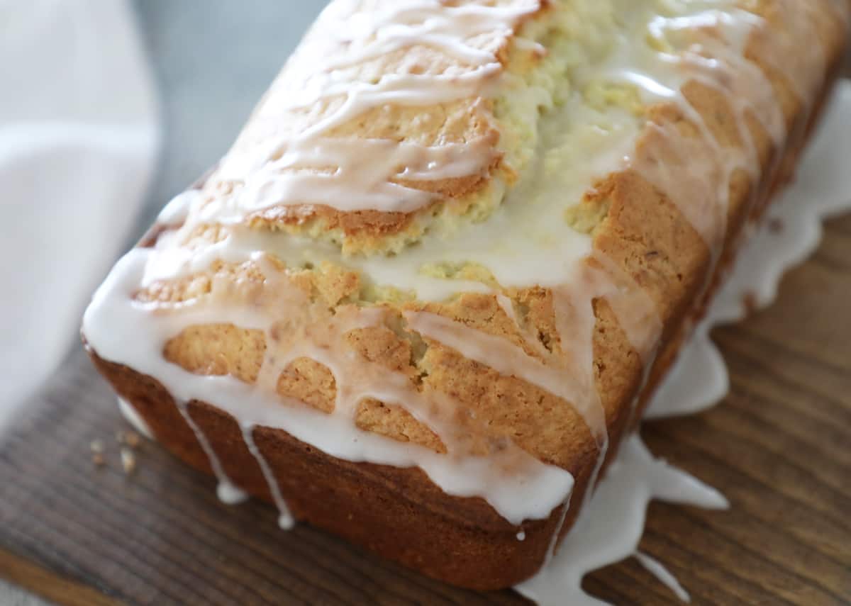 A side view of lemon zucchini bread with lemon glaze. 