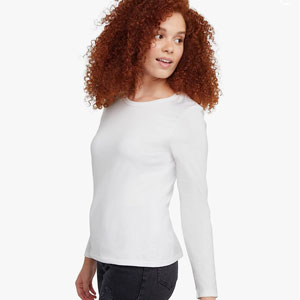 Woman modeling a white long sleeved t-shirt.