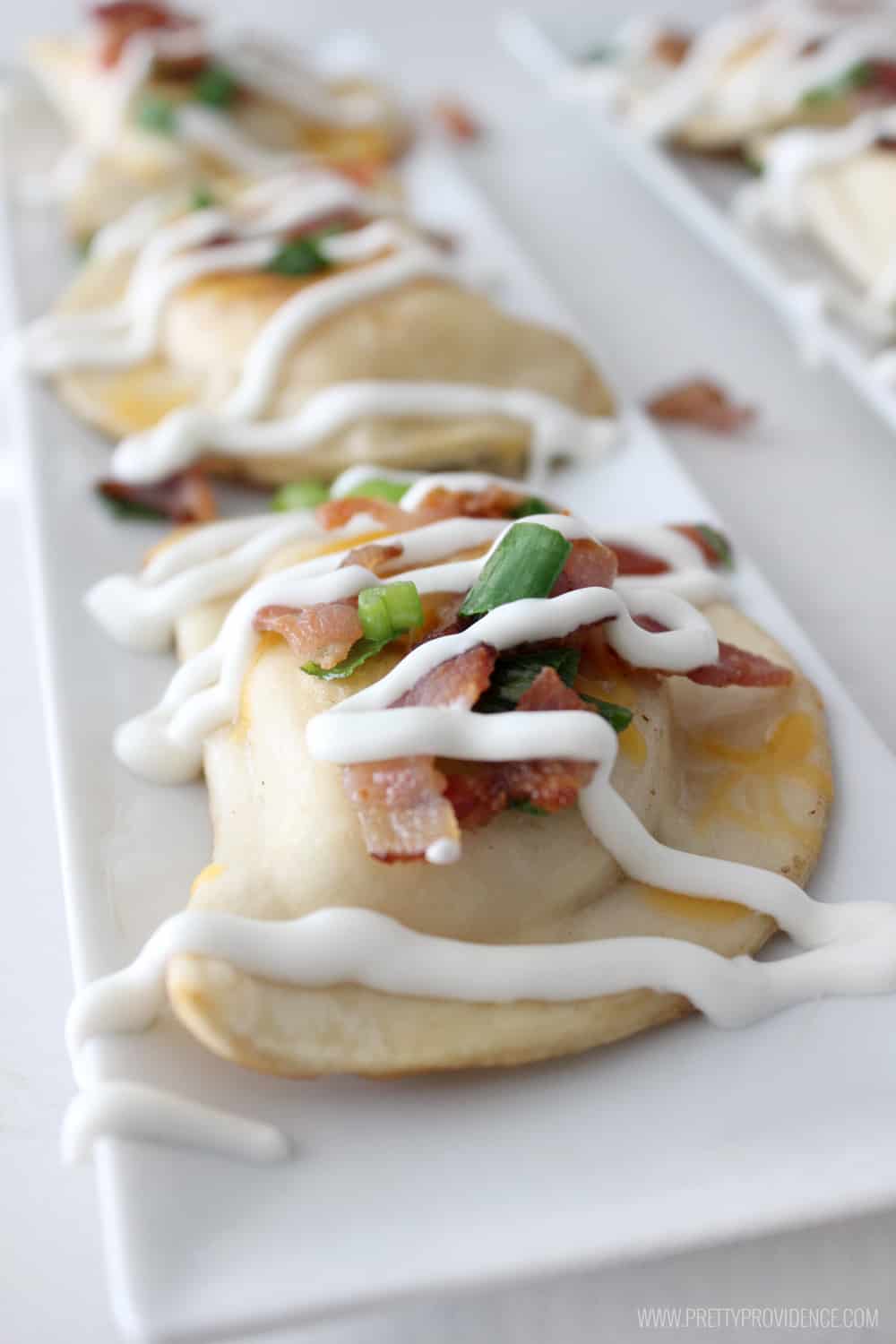 This SUPER EASY Pierogy appetizer is so delicious! Perfect for watching the game with friends or making a date night in of your favorite TV series! 