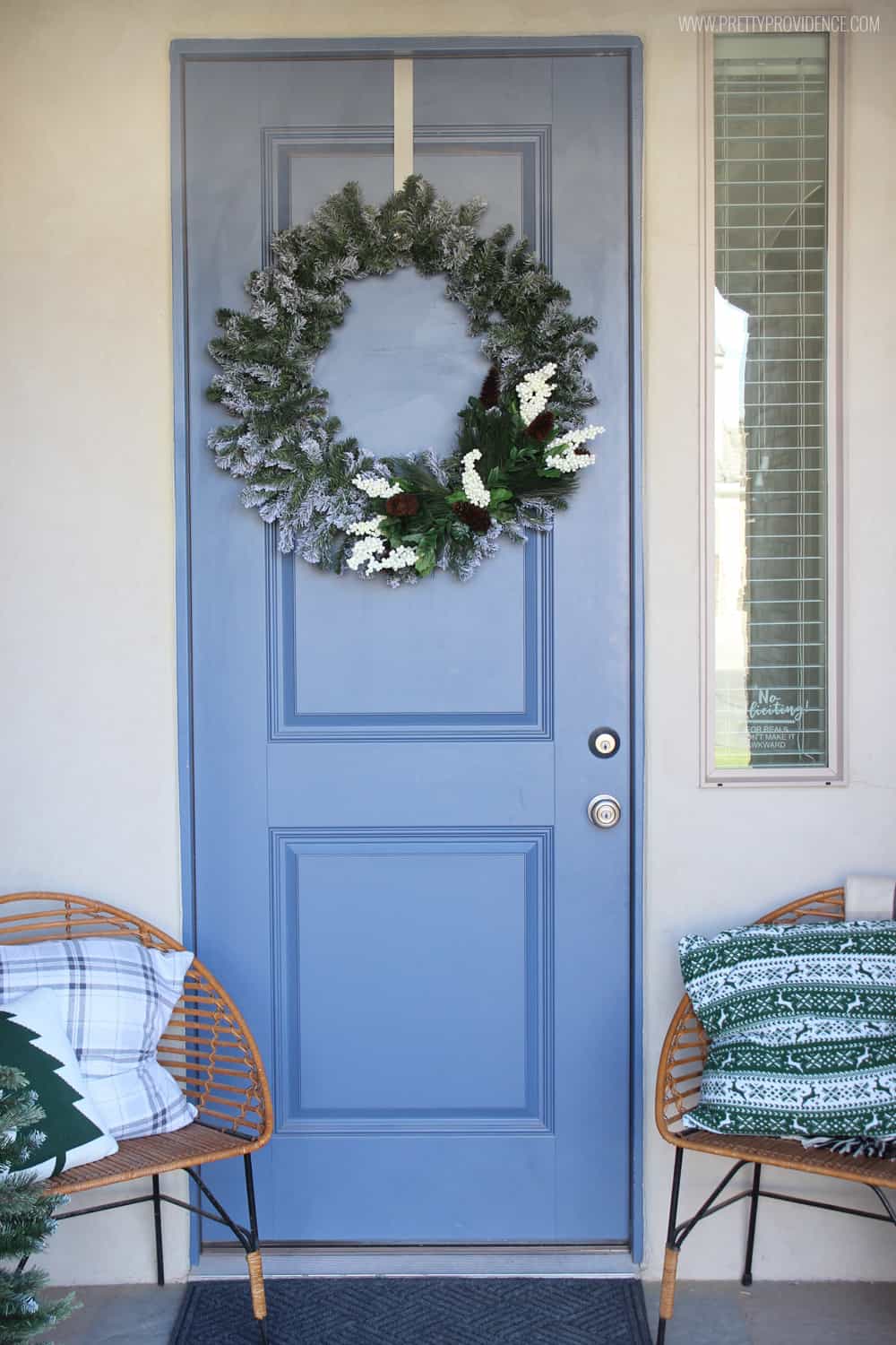 I am loving the color scheme of this beautiful Christmas front porch!