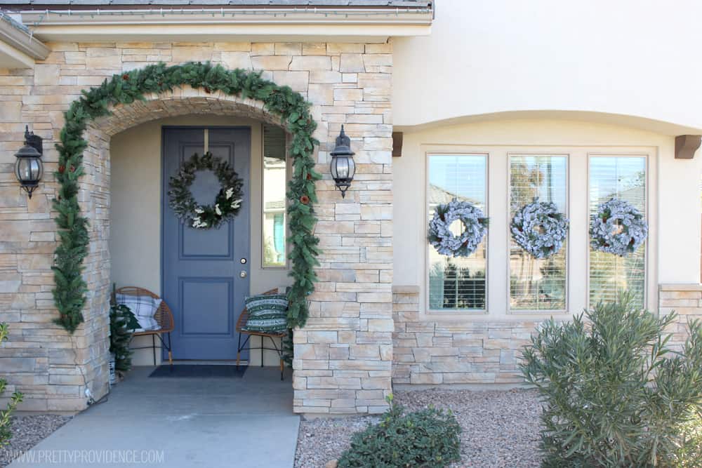 I am loving the color scheme of this beautiful Christmas front porch!