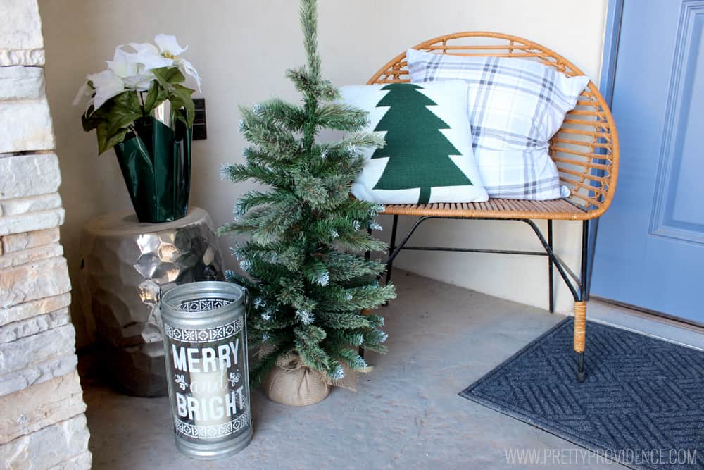 I am loving the color scheme of this beautiful Christmas front porch!