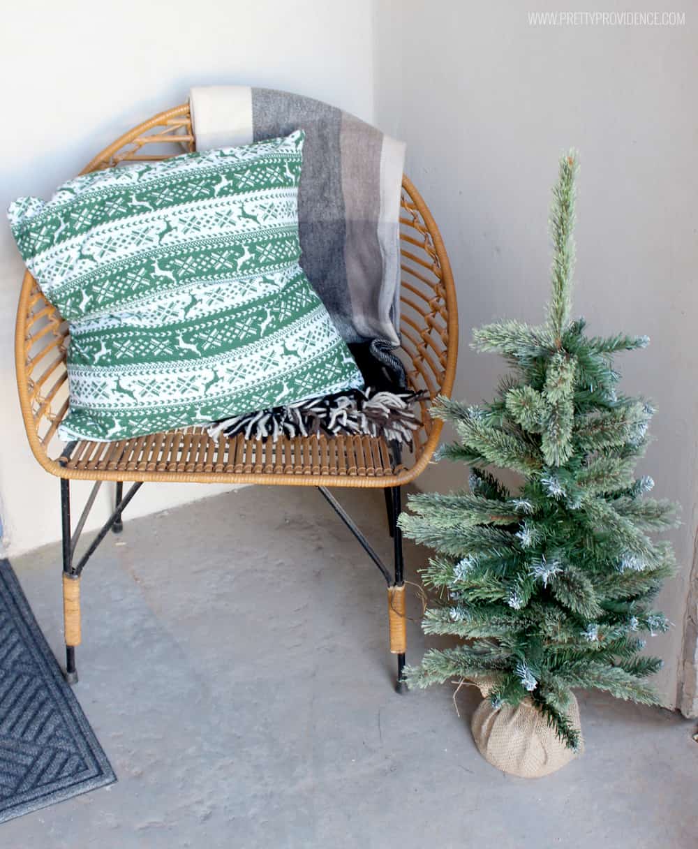 I am loving the color scheme of this beautiful Christmas front porch!