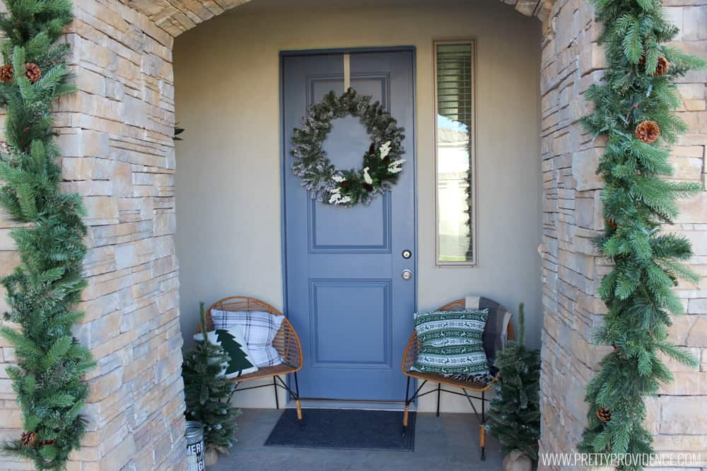 I am loving the color scheme of this beautiful Christmas front porch!